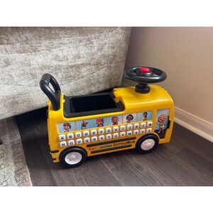 CoComelon Musical School Bus Ride-On Toy Yellow Learning Letters Numbers Storage